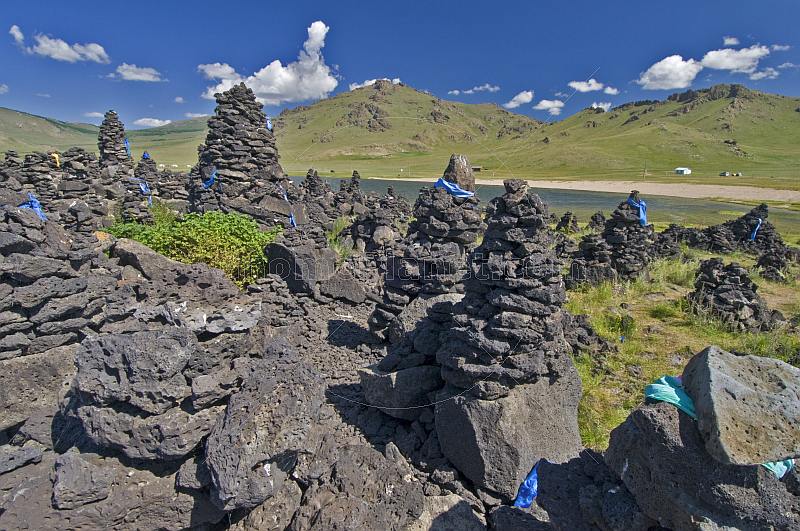 Shamanist volcanic stone mounds at the Terkhiin Tsagaan Nuur, the 'Great White Lake'.