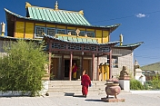 A Buddhist monk hurries to a service in the Gandan Muntsaglan Khiid monastery.