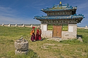 Young monks pass a blue-tiled temple at the Erdene Zuu Khiid (Hundred Treasures Monastery).