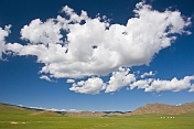 Clouds over the wide expanse of the Mongolian Plain.