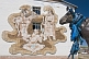 Mongolian cultural wall mosaic and horse statue with prayer scarves.