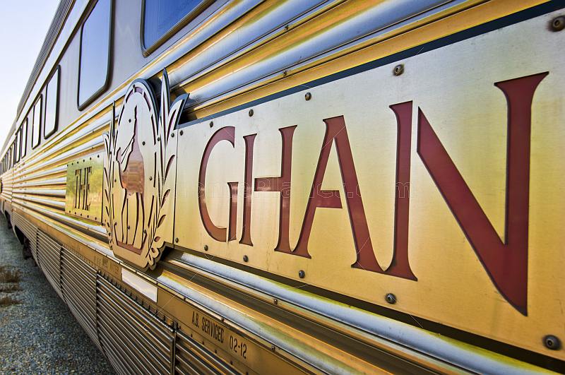 Ghan train signboard and logo on carriages at Alice Springs railway station.