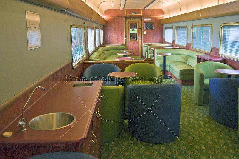 Facilities and seating in the Red Gum Lounge Car of the Ghan long distance train.