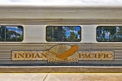 'Indian Pacific' coach with tree reflections in the windows