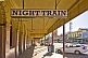 Sign for Night Train bar on deserted downtown Argent Street.