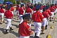 Young mascot recruits from the State Fire Service 'Cuerpos de Bomberos' take part in the national Flag Day Parade of 2014.