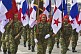 Women soldiers of the Panamanian Defense Forces parade with their national flag along the Avenida Balboa in Panama City.