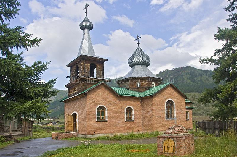 Brick-built Russian Orthodox church with onion domes.