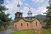 Brick-built Russian Orthodox church with onion domes.