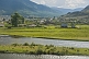 Image of Small Russian town of log houses nestles between the Altai Mountains and the river.