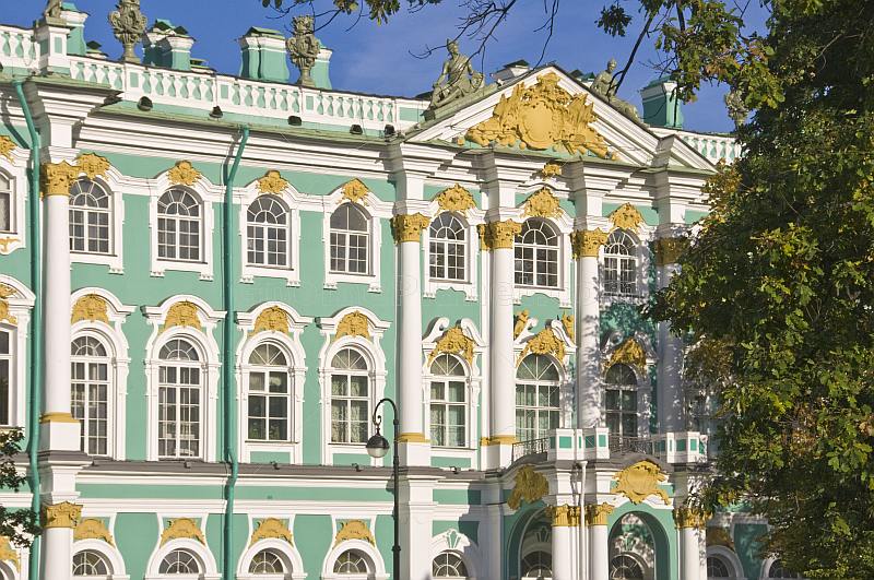 Green and white stucco-work of the Admiralty Buildings, by the River Neva.