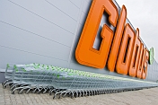 Lines of stainless steel shopping trolleys outside Globus, a modern Russian supermarket.