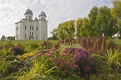 Cathedral of St George at the Yurev Monastery, set in a colourful garden of flowers.