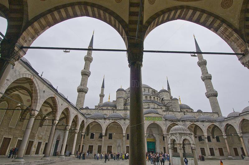 A crowd of tourists visit the courtyard of the Sultan Ahmet Camii, or Blue Mosque, in Sultanahmet.