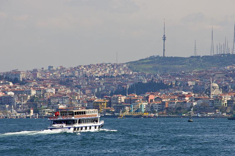 A ferry boat crosses the Bosphorus, heading for Uskudar, on the Asian side.