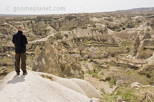 A male tourist surveys the valley of caves near Goreme.
