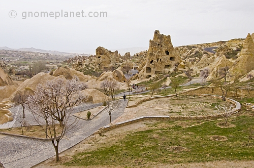 Visitors wander around the valley of rock-cut cave churches near Goreme.