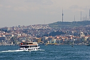 A ferry boat crosses the Bosphorus, heading for Uskudar, on the Asian side.