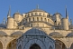 Image of Domes of the Ahmet Camii Blue Mosque lit by evening sunshine.