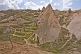 Group of tuft cave dwellings next to trees in blossom, near Goreme.