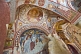 Image of Desecrated Christian paintings in an ancient church carved out of a cave.