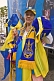 Woman sells yellow and blue memorabilia on Ukraine Independence Day.