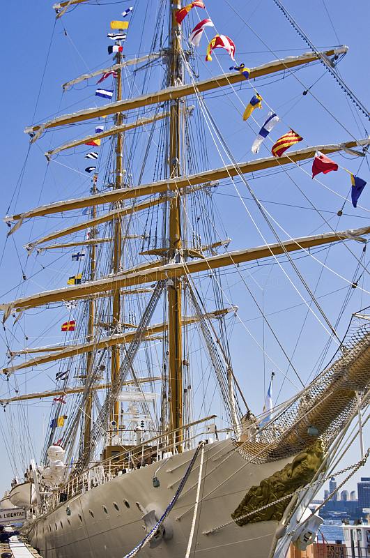 Colorful signal flags adorn the rigging of the tallship 'Libertad'.