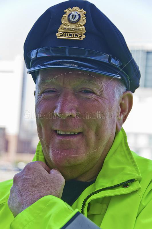 Massachusetts Port policeman in yellow reflective jacket.