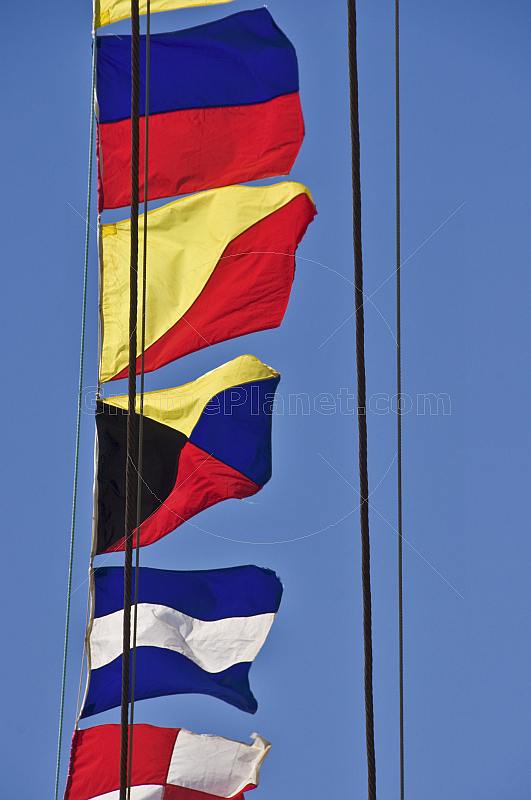 Colorful signal flags on rigging of the Russian tallship 'Kruzenshtern'.