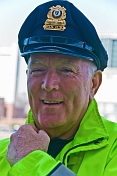 Massachusetts Port policeman in yellow reflective jacket.