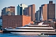 Image of Luxury cruiser 'Odyssey' sails through Boston harbor in late evening.