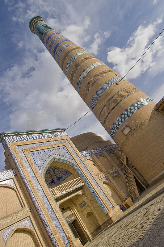 Minaret and Madrassah of Islam-Khodja, with its traditional Islamic blue glazed tile-work.