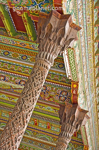 Intricately carved pillars and painted wooden ceiling in the Juma Mosque (Friday Mosque).