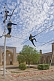 Image of Circus Highwire Walkers perform in the courtyard of an old madrassa.