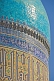 Image of Sunshine reflects off the luminous blue tilework on a dome of the Miri-Arab Madrassah.