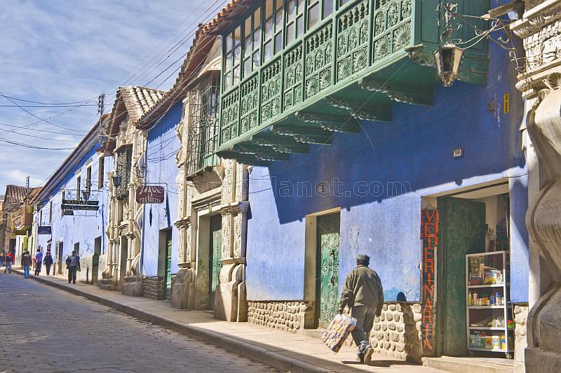 Man walks past the Hostal Las Tres Portadas on Calle Bolivar.
