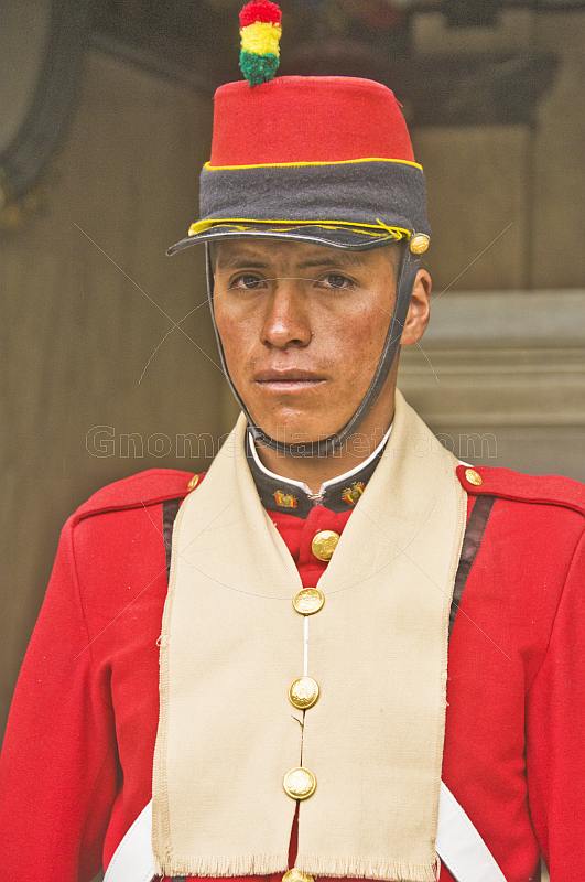 Guardsman in red uniform outside the Presidential Palace (Palacio Presidencial).