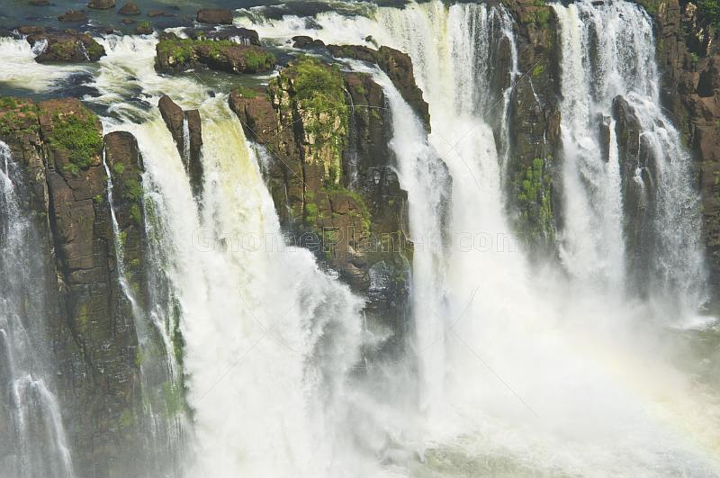 Water cascades over the rocks at the Iguazu Falls.
