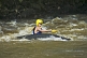 Image of Canoeist in red Dagger kayak negotiates some rough water.