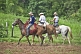 Image of Three Brazillian cowboys on horseback.