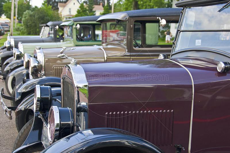 A row of vintage motor cars parked on Queens Street.
