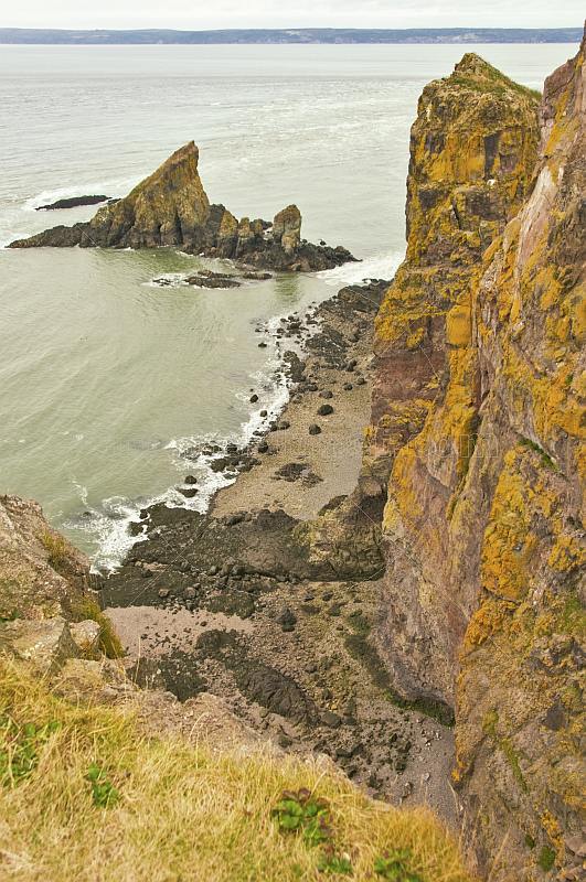 Steep lichen covered cliffs and rocky outcrops at the Cape Split Provincial Park Reserve.