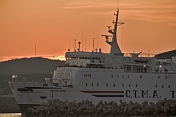 The C.T.M.A. ferry 'Madeleine' leaves the harbor at dusk.