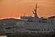 Image of The C.T.M.A. ferry 'Madeleine' leaves the harbor at dusk.