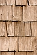 Image of Detail of an ancient wooden shingled barn wall.