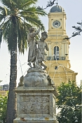 Statue in the Plaza de Armas and the National History Museum in background.