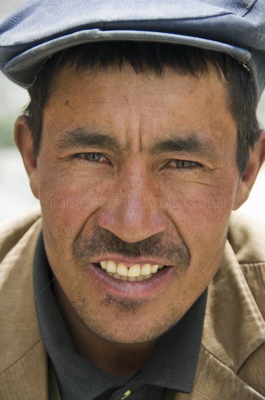 Local Uighur Trader sells curios and jade to travellers on the Karakoram Highway.