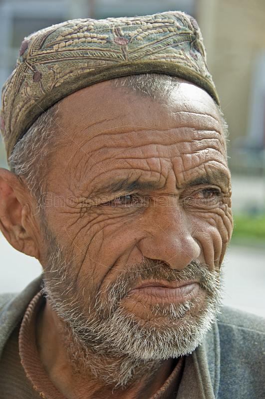 Elderly Uighur man with hat.
