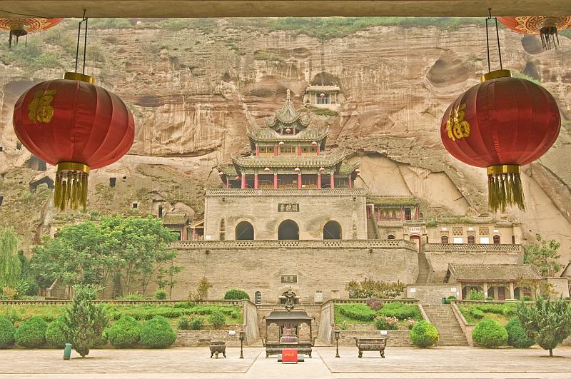 The Bing Si Buddhist temple, near Qian Xian, framed by Chinese lanterns.