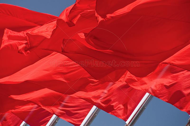 Red flags for the Peoples Republic of China billowing in the wind of Tiananmen Square.